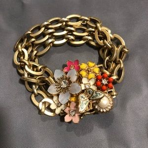 JUICY COUTURE: Gold plated bracelet with flowers